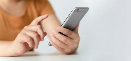 Young Asian woman using smartphone typing, chatting conversation. Social Network, technology concept photo