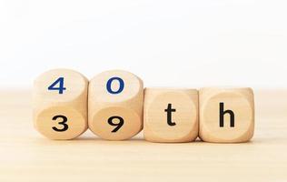 Turning 40 years old concept. Text on wooden blocks and changing dices