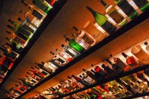 Buenos Aires, Argentina - May 22, 2007 -  Several types of bottled alcohol and liquor are displayed on some shelves in a pub. photo