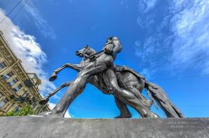 Horse Tamer sculpture of the 19th century on the Anichkov Bridge in St. Petersburg Attraction, Russia. photo