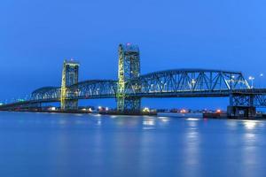 Marine Parkway-Gil Hodges Memorial Bridge as seen from Rockaway, Queens at dusk. Built and opened in 1937, it was the longest vertical-lift span in the world for automobiles. photo