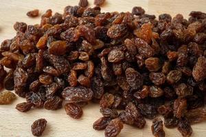 Brown raisins on the table. Diet healthy food. photo