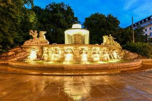 The famous Wittelsbach Fountain built in 1895, Lenbachplatz, Munich, Upper Bavaria, Germany. photo
