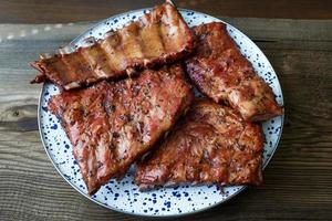 Homemade smoked barbecue pork ribs ready to eat photo