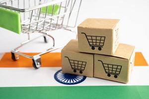 Box with shopping cart logo and India flag, Import Export Shopping online or eCommerce finance delivery service store product shipping, trade, supplier concept. photo