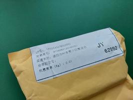 KIEV, UKRAINE - DECEMBER 28, 2022 Envelopes arrived by parcel from China photo