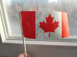 Canada country flag in winter season photo