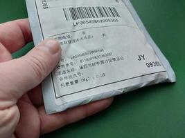 KIEV, UKRAINE - DECEMBER 28, 2022 Envelopes arrived by parcel from China photo