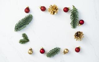 Mockup for a letter or a Christmas invitation with gold fir cone photo