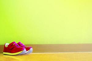 a pair of shoes leaning against the wall photo