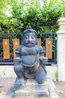 a typical Balinese statue is displayed in front of the house photo
