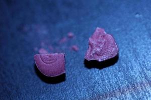 Pink skull ecstasy pill close up background high quality print purple army dope narcotics substance high dose psychedelic way of life photo