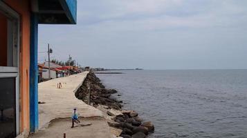 Coastal embankment retaining tidal waves photo