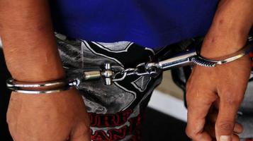 Man handcuffed hands. Prisoner or arrested. photo