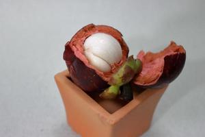 Purple mangosteen fruit with delicious core. Cancer prevention fruits photo