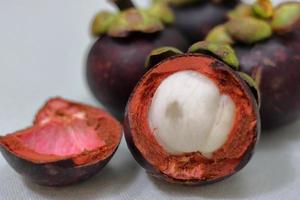 Purple mangosteen fruit with delicious core. Cancer prevention fruits photo