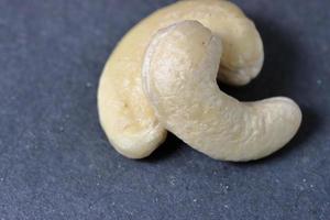 Cashew nuts on a back background. Group of cashew nuts on back background photo
