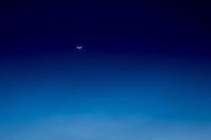 Night sky nature background with crescent moon photo