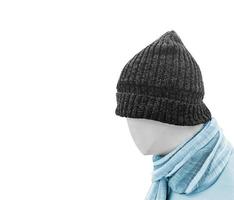 Blue knitted hat model head with scarf isolated on white photo