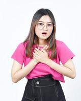 Hands on Chest with Shocked Face Expression Of Beautiful Asian Woman Isolated On White Background photo