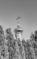 Christian church cross in high steeple tower for prayer photo