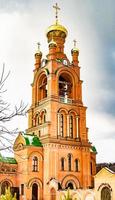 Christian church cross in high steeple tower for prayer photo