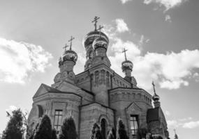 Christian church cross in high steeple tower for prayer photo