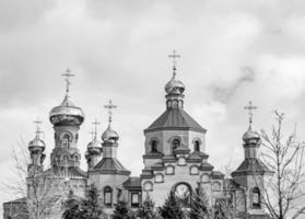 Christian church cross in high steeple tower for prayer photo