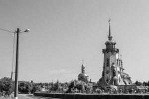 Christian church cross in high steeple tower for prayer photo