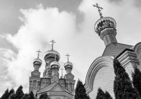 Christian church cross in high steeple tower for prayer photo