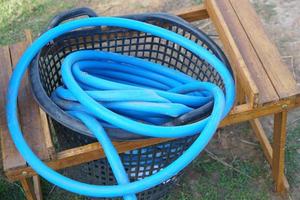 Basket for storing agricultural hoses photo