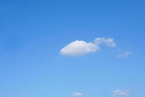 Blue sky with fluffy white clouds constantly changing shape. photo