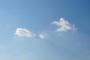 Blue sky with fluffy white clouds constantly changing shape. photo