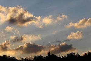 Rain clouds in the sky above the forest. photo