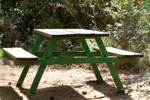 Bench for rest in the city park on the seashore. photo