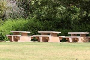Bench for rest in the city park on the seashore. photo