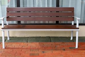 Bench for rest in the city park on the seashore. photo