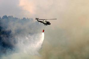 A helicopter puts out a forest fire in the mountains of northern Israel. photo