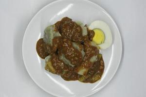 Siomay with peanut sauce on a plate from top photo