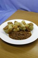 Batagor with peanut sauce on a plate photo