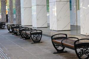 Wooden chairs provided by the government for tourists to enjoy Jalan Malioboro Yogyakarta. photo