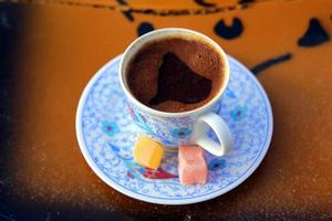 Travel to Cappadocia, Turkey. The cup of flavoured turkish coffee with sweets. photo