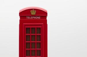 Red London Street Phone Booth Isolated on White Background. photo