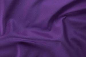 4 smooth purple cotton Texture, curved silk background, pattern. Texture of purple silk fabric. Beautiful emerald soft silk. photo