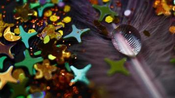 Close-up Of water drop with glitter on it in different colorful loghts in Karachi Pakistan 2022 photo