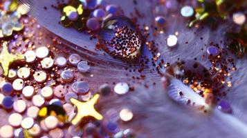 Close-up Of water drop with glitter on it in different colorful loghts in Karachi Pakistan 2022 photo