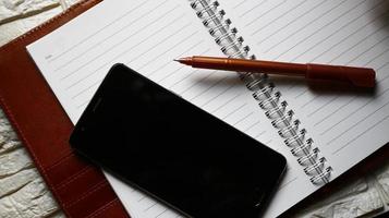Work Bag And Office Diary On Table in Karachi Pakistan 2022 photo