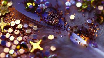 Close-up Of water drop with glitter on it in different colorful loghts in Karachi Pakistan 2022 photo