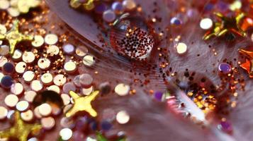 Close-up Of water drop with glitter on it in different colorful loghts in Karachi Pakistan 2022 photo
