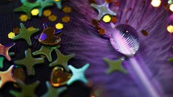 Close-up Of water drop with glitter on it in different colorful loghts in Karachi Pakistan 2022 photo